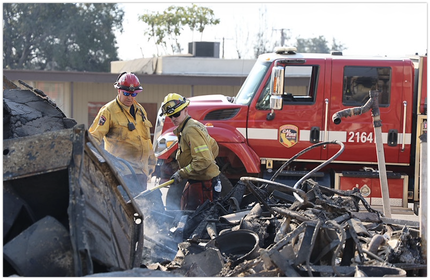 Image: Eaton firefighters cleaning debris. Source: www.fire.ca.gov