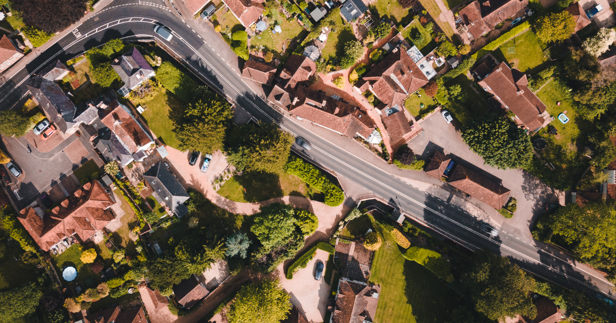 Aerial view of a residential neighborhood with various structures.